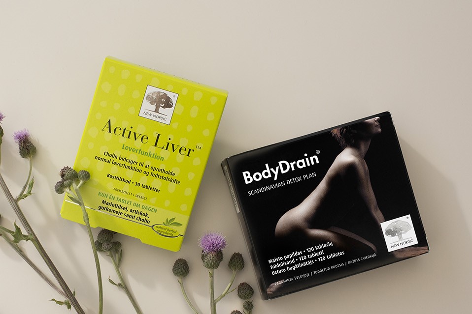 New Nordic Active Liver™ ir BodyDrain® maisto papildai, pateikti su margainių žiedais.